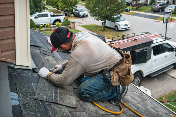 Professional Roofing technician working in Cambridge, MA